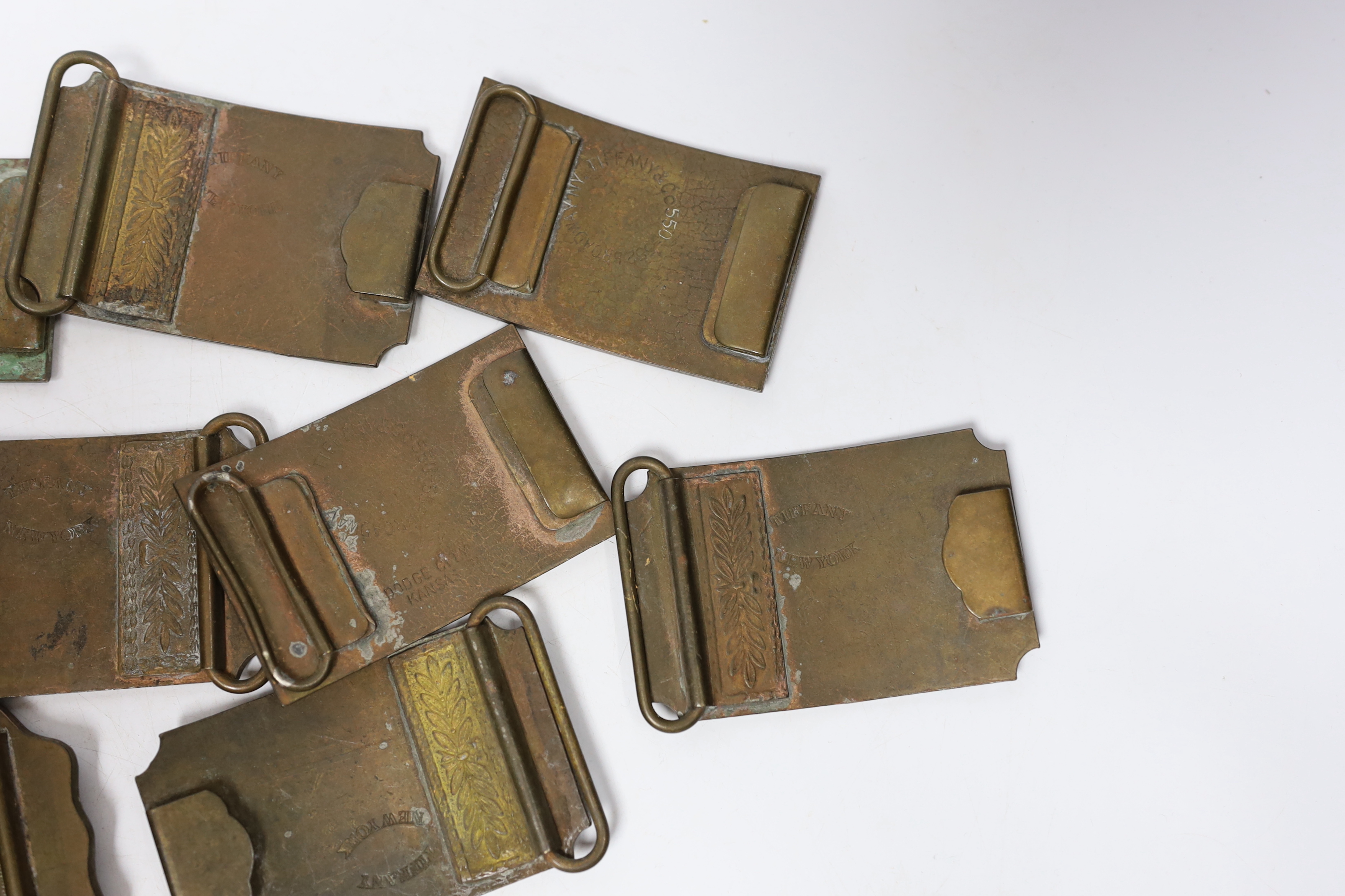 A collection of Wells Fargo and similar belt buckles, mostly by Tiffany & Co.